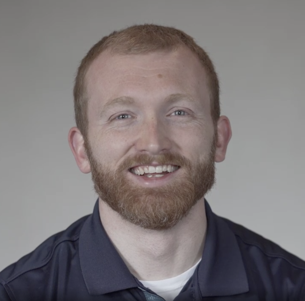 Headshot of Adam Carlson